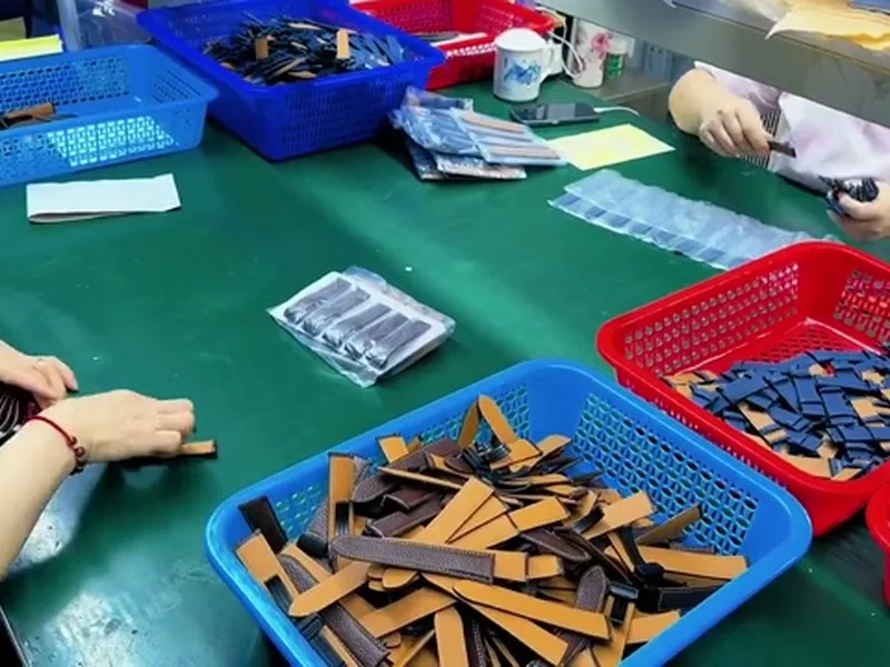 Watch straps prepared on work table for packing